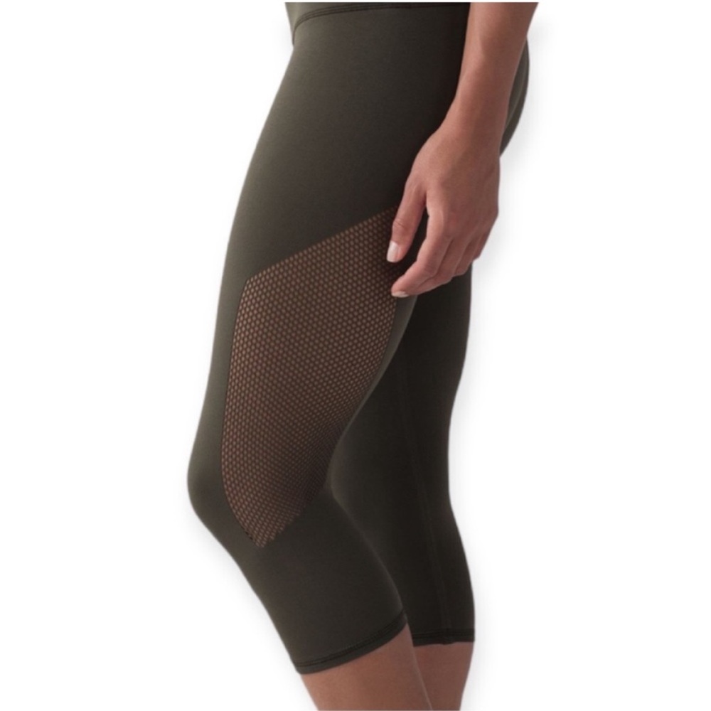 Lululemon Reveal Cutout Cropped Leggings in Dark Olive